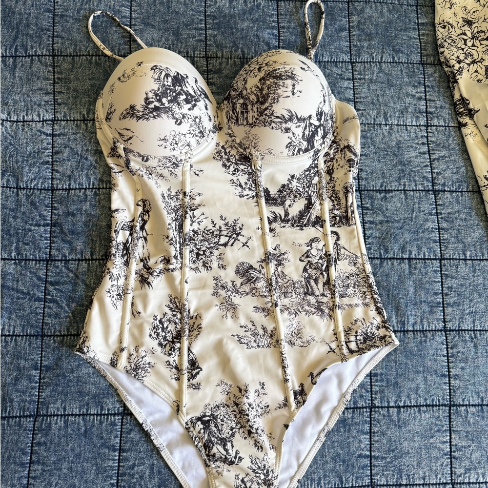 Woman's one piece swim suit and cover up skirt size L